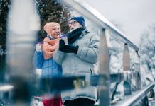 Preparing for Winter in Australia – Tips to keep elders safe Cheerful elderly people walking with hot chocolate in paper cups and smiling while enjoying winter day outdoors